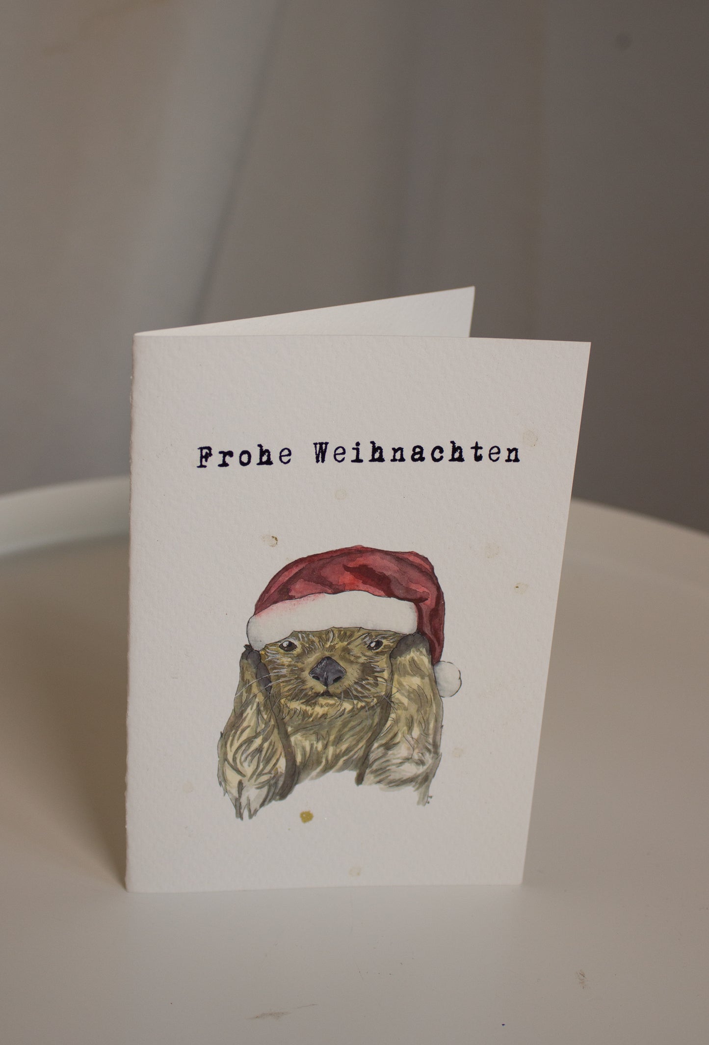 Weihnachtskarte "Frohe Weihnachten" Otter